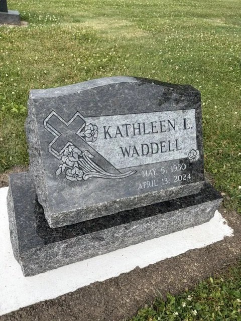 A real upright granite memorial from the Headstones and Blooms design gallery